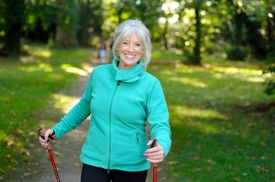 A woman nordic walking in the park.